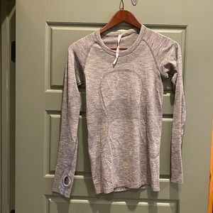 LuluLemon gray athletic top with thumb holes.
